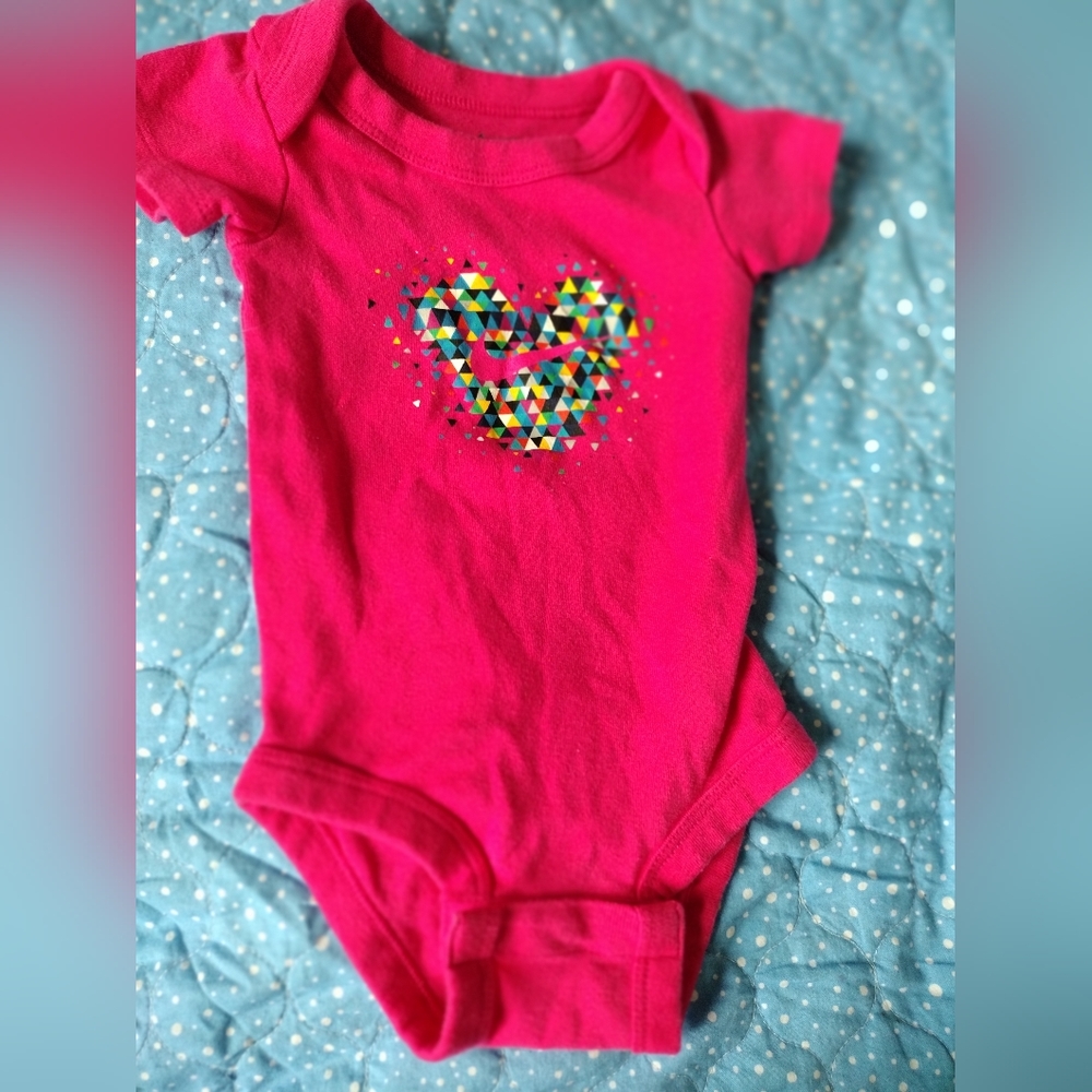 Pink baby Nike body suit